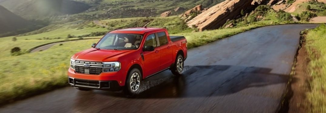 Red 2024 Ford Maverick Driving on a Country Road