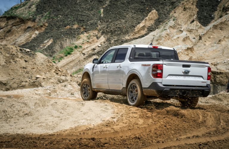 White 2023 Ford Maverick Tremor Rear Exterior on a Trail