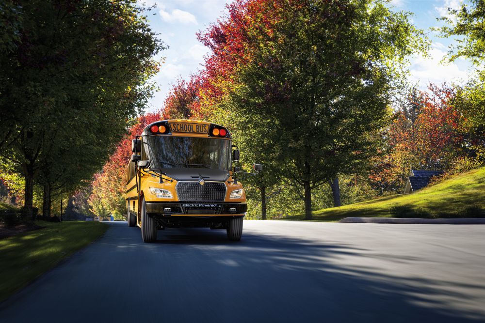 IC Bus driving through residential neighborhood