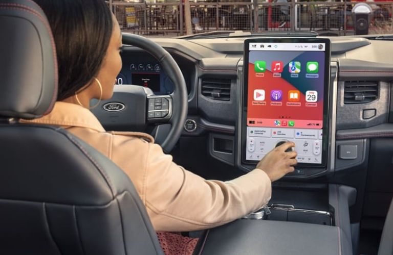 Woman Using the 15.5-Inch Touchscreen in the 2024 Ford Expedition 