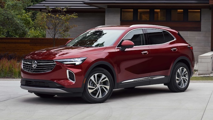 red 2023 buick envision parked in front of a house