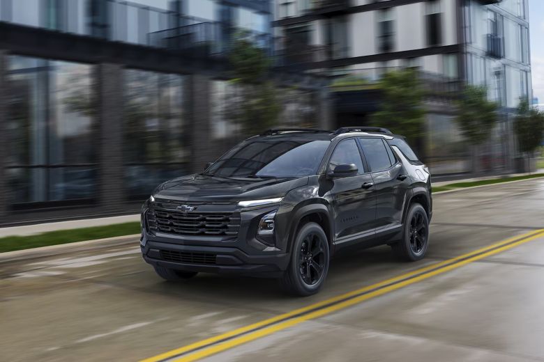 A black suv driving on the road.