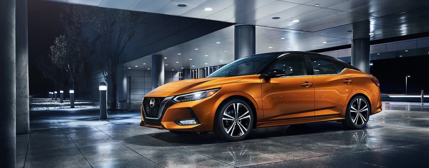 An orange 2023 Nissan Sentra from the side.