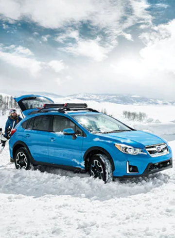 Subaru Crosstrek in blue in a cold environment.