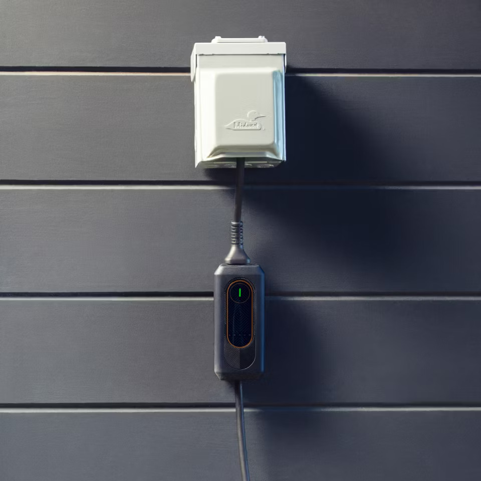 Lexus mobile charger hanging from outlet.