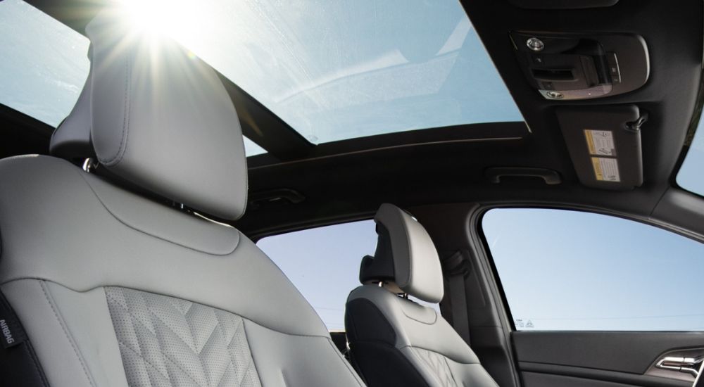 Front seats and moonroof in a 2025 Kia Sportage X-Pro Prestige