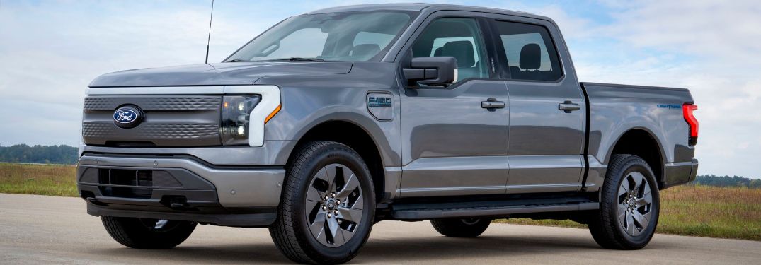 Gray 2024 Ford F-150 Lightning Flash Trim Level on Country Road