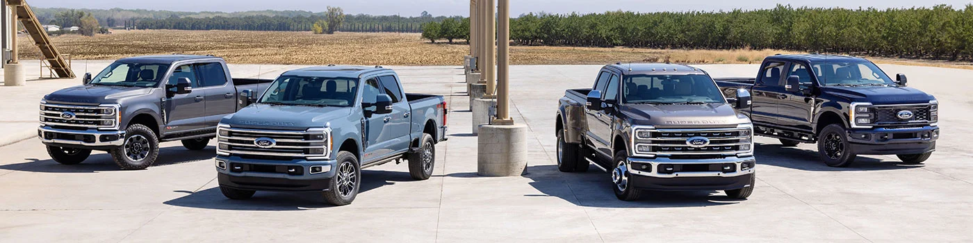 image of lineup of four ford trucks