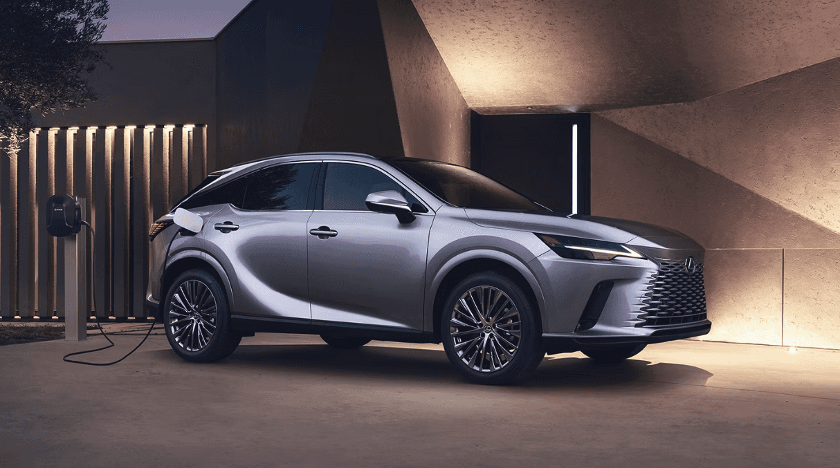 Side view of the 2024 Lexus RX Plug-In Hybrid plugged into a charger