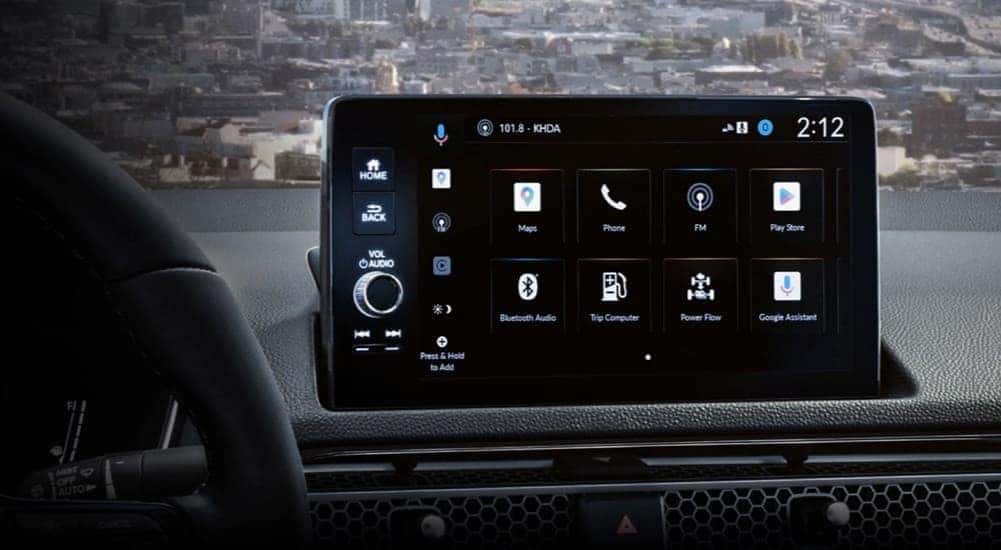 A close-up of the infotainment screen in a 2025 Honda Civic is shown.