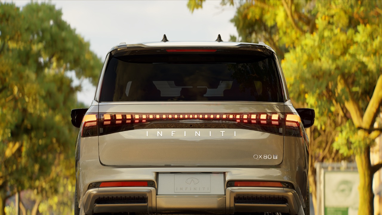 A blue Infiniti sedan driving in a city, showcasing the sleek design and luxury features of Infiniti vehicles. The image highlights the elegance and performance of the Infiniti brand, appealing to discerning customers seeking quality and style in their automotive choice.