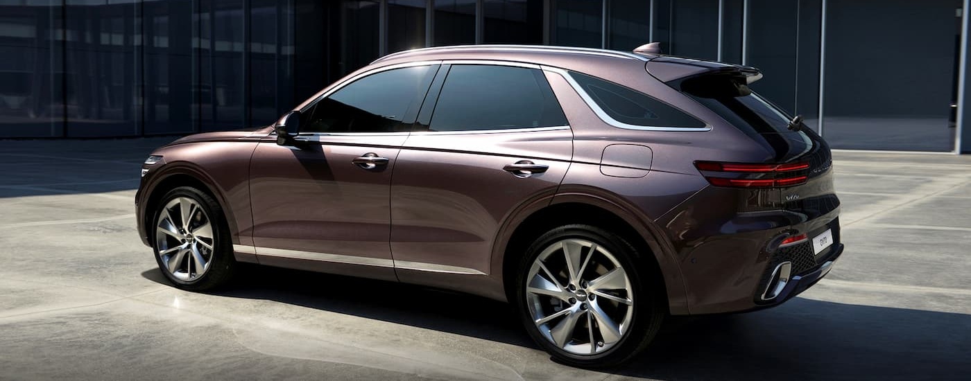 Rear of a brown 2020 Genesis G70 parked on pavement.