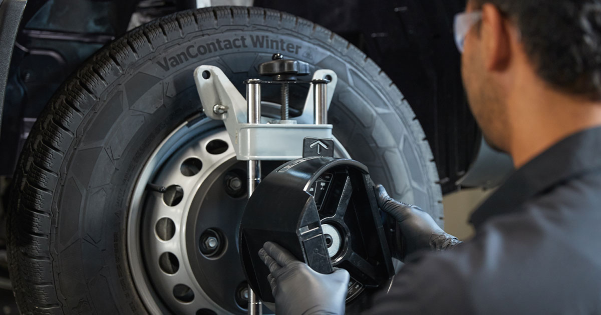 Mercedes-Benz technician works on a tire
