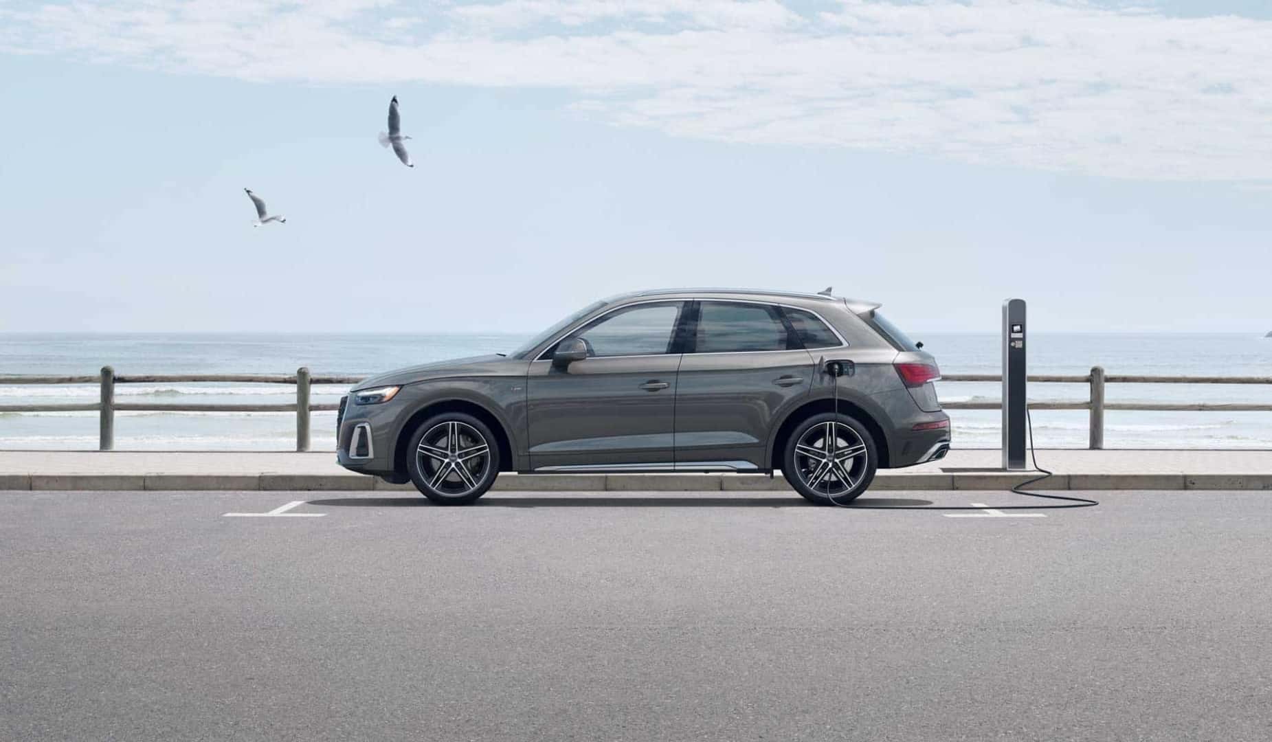Audi TFSI Plug-In Hybrid charging by the ocean.