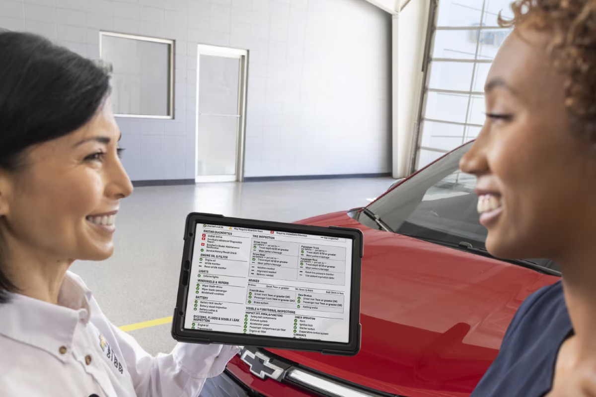 2024 Chevy Vehicle with Customer and Tech Discussing Multi-Point Inspection