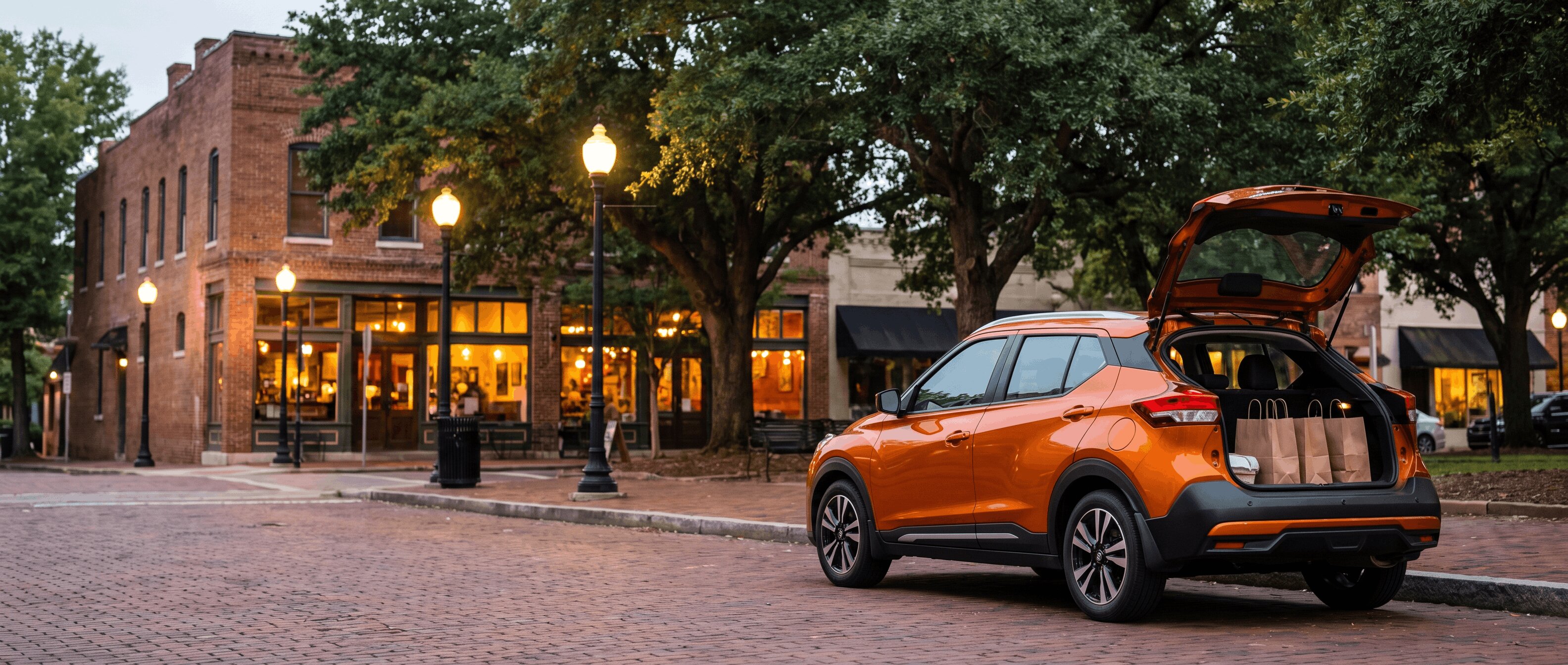 Nissan Kicks hatchback open with takeout bags on Canton Street in Roswell GA