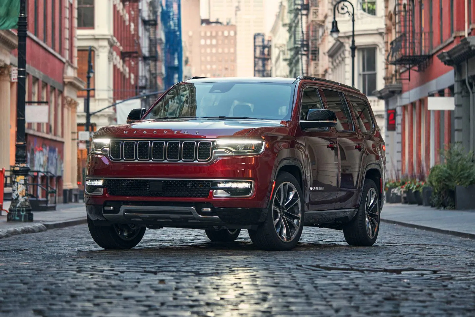 A red suv sitting parked.