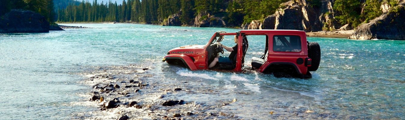 2024 Jeep Wrangler Exterior Driver Side Rear Profile while Off-Road Water Fording