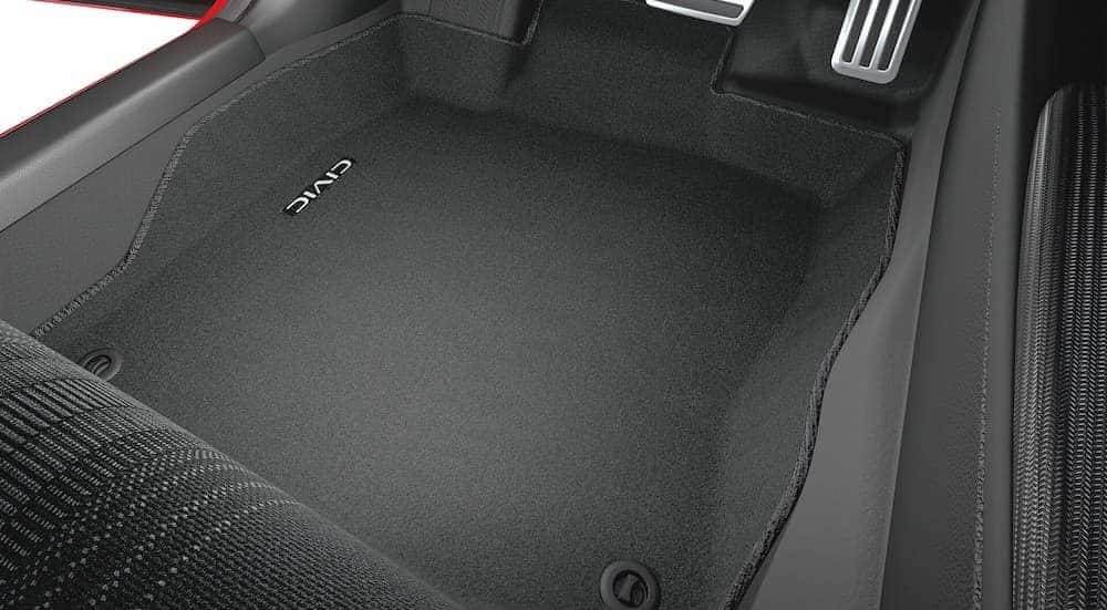 A close-up of the floormat is shown in a 2025 Honda Civic Sport Hybrid.