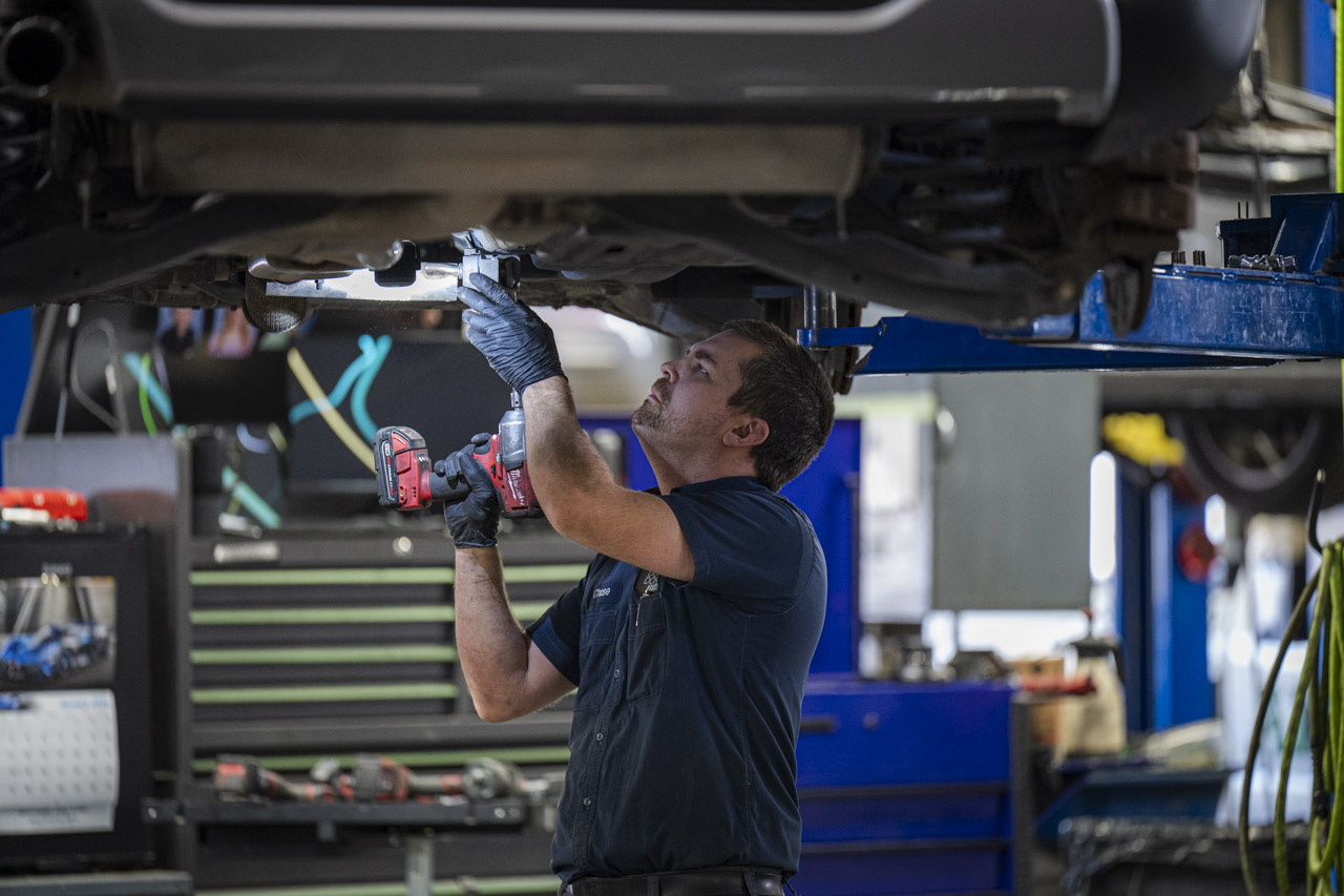 Automotive technician repairing a customers vehicle at Don Hattan Dealerships