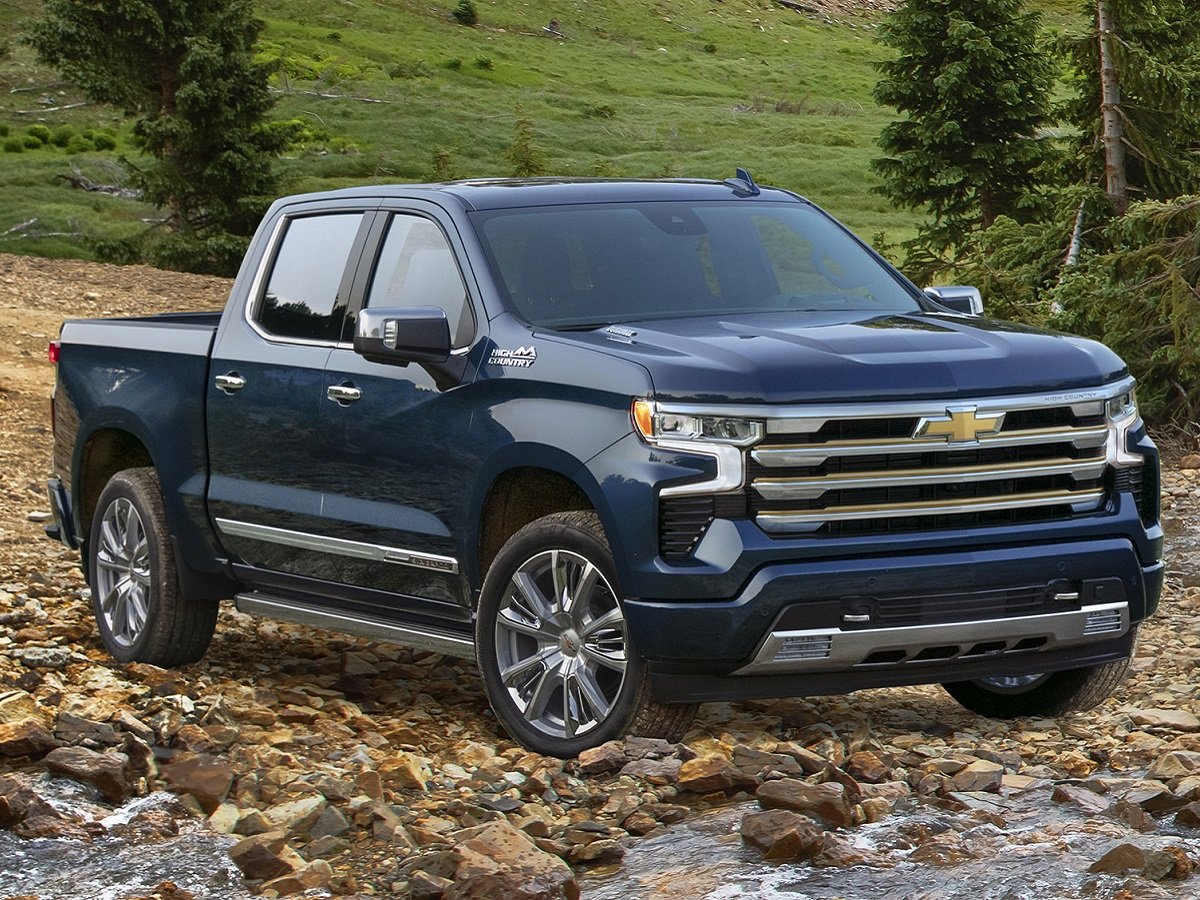 blue 2023 Chevy Silverado 1500 parked in the woods