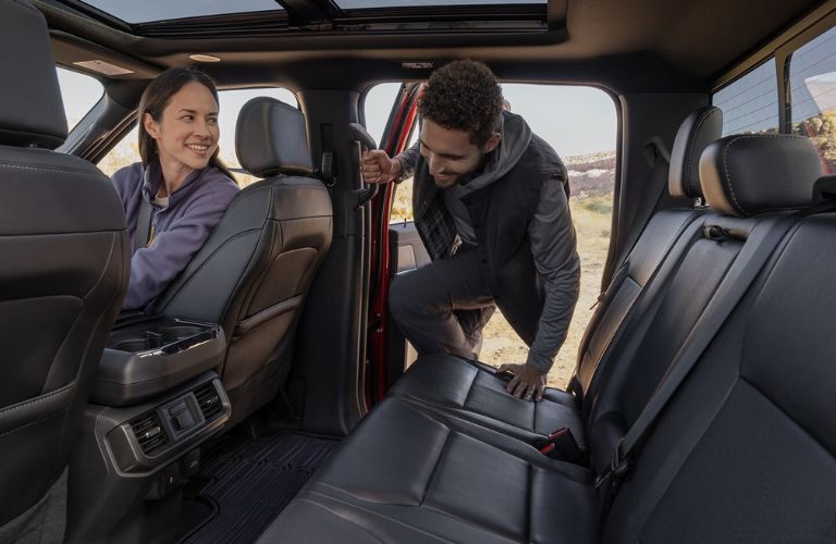 Man Getting in the Back Seat of 2024 Ford F-150