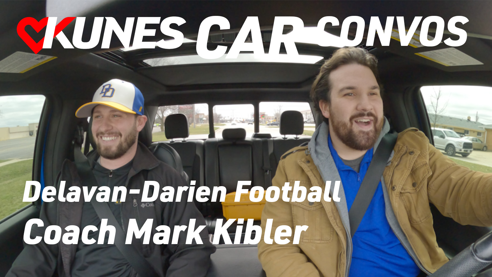 Text reads: Kunes Car Convos; Delavan-Darien Football; Coach Mark Kibler
Pictured left to right: Mark Kibler, Delavan-Darien High School football coach, and Evan Ferguson, Kunes Auto Group videographer