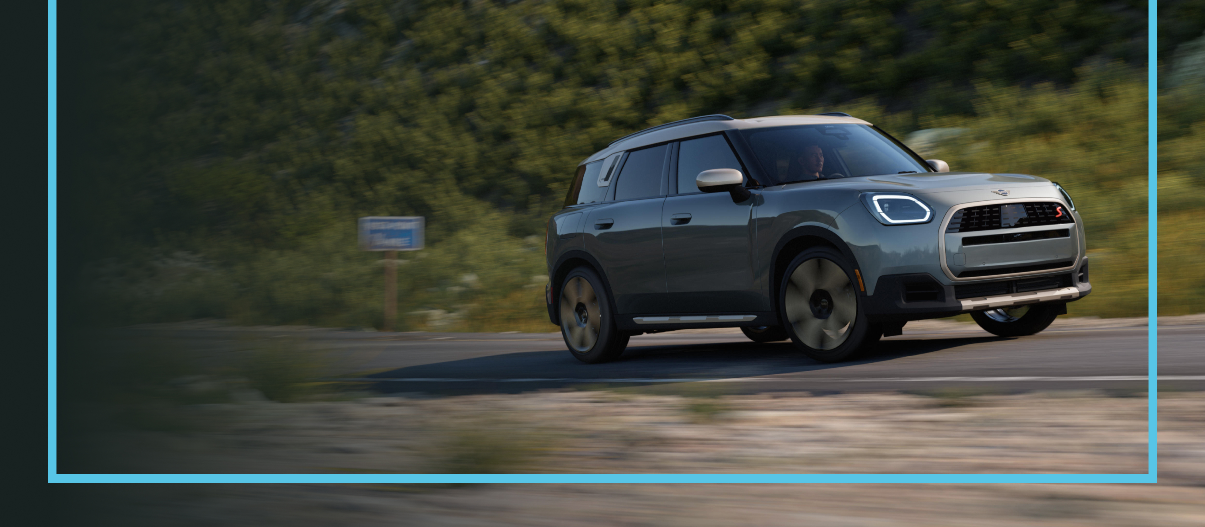A MINI Countryman S ALL4 cruising down a road.