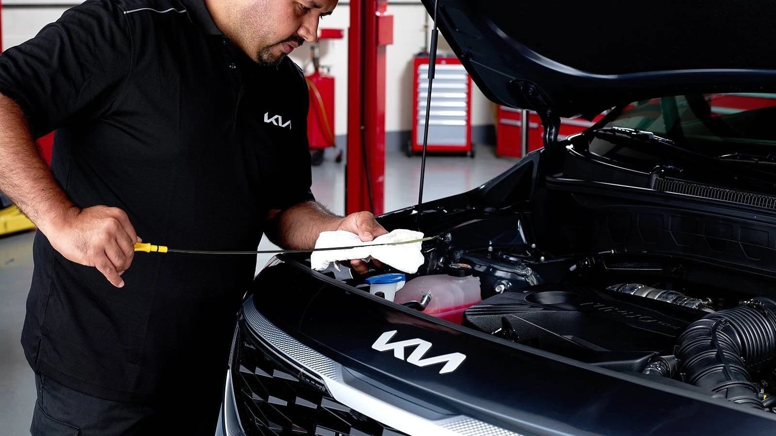Mechanic changing car oil