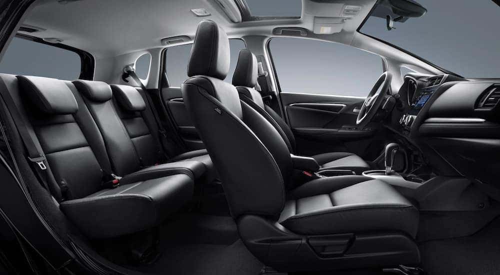The black interior in a 2020 Honda Fit EX-L is shown from the side.