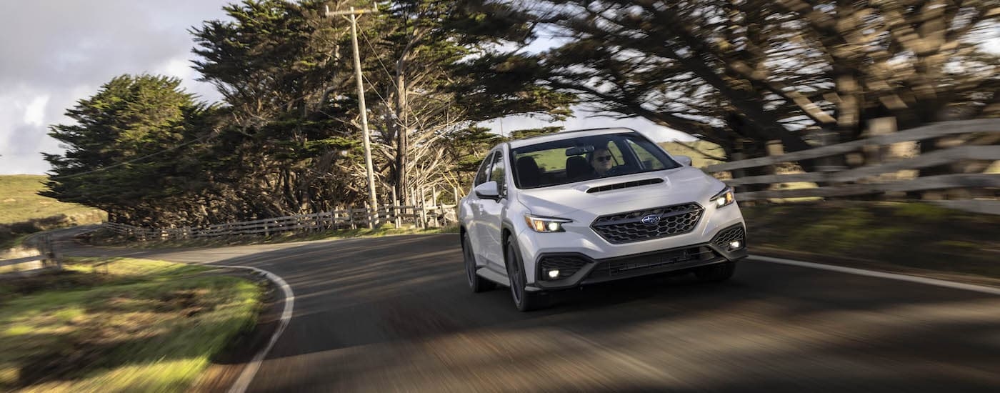 White 2022 Subaru WRX leaving a Subaru dealer in Rhinebeck
