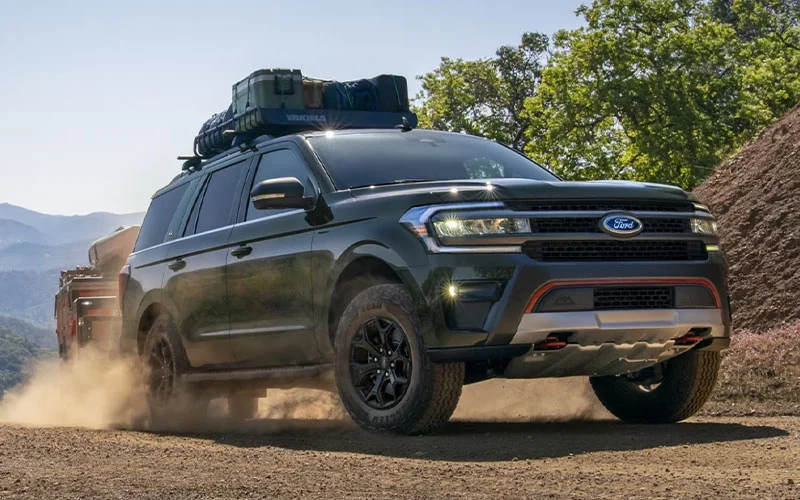 image of black ford suv with luggage on track