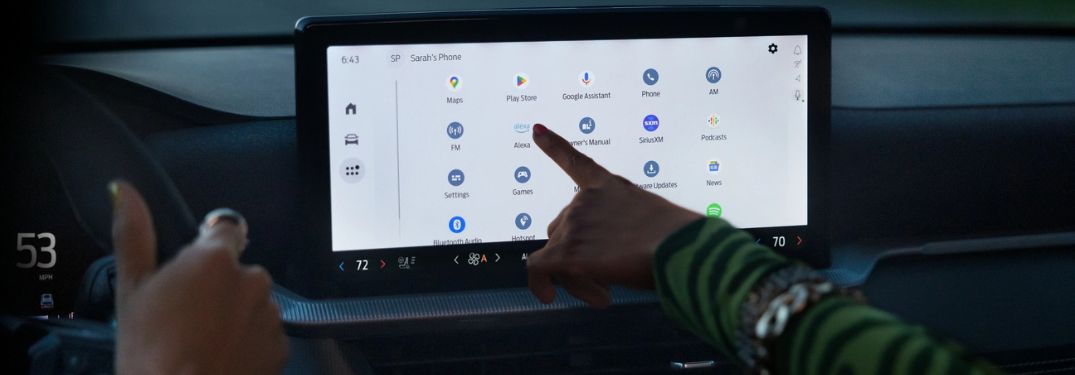 Close Up of People Using the Ford Digital Experience Touchscreen