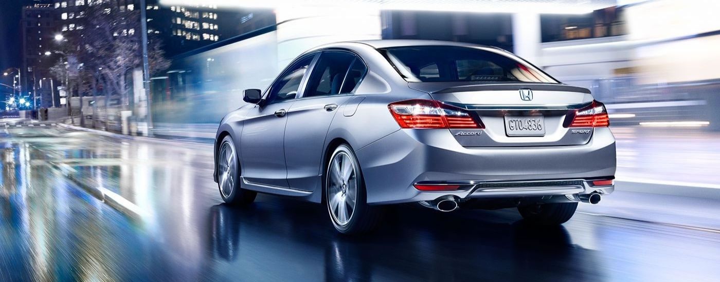 Silver 2017 Honda Accord Sport driving on a city street