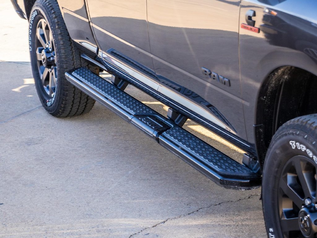 Side-step and body detail on a used Ram 2500 from dealership inventory