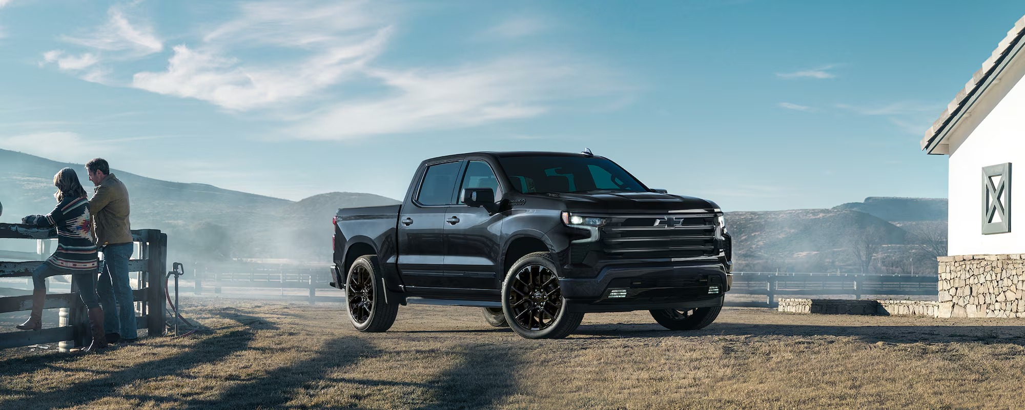 2025 Chevrolet Silverado Truck that is military rugged and all black on a ranch.