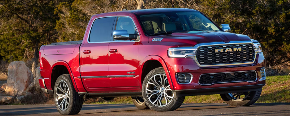 The red RAM 1500 is parked on the road