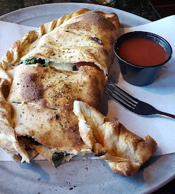 margherita calzone with a side of marinara