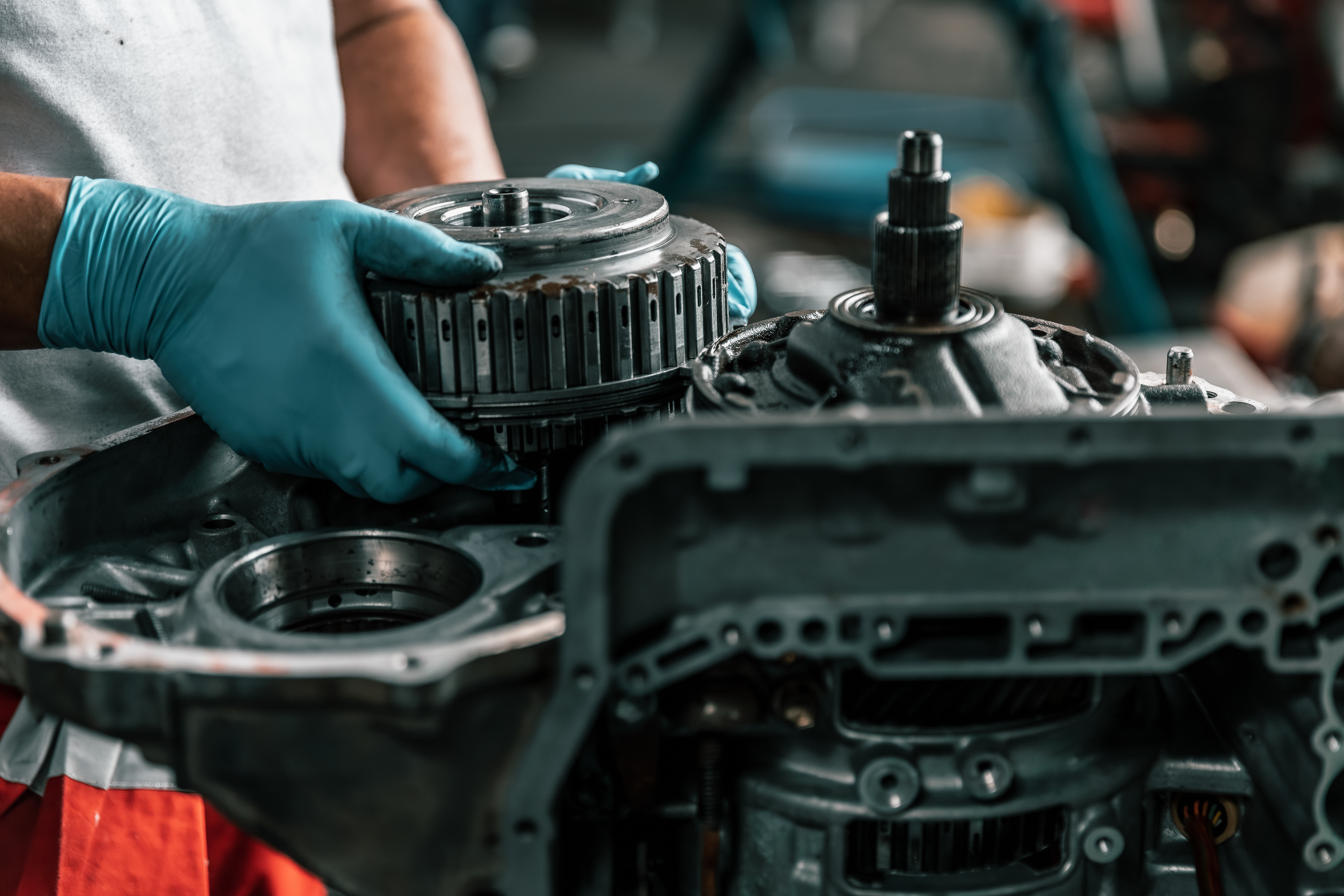 Certified technician performing a transmission fluid flush and diagnostic on a vehicle in Wichita, KS