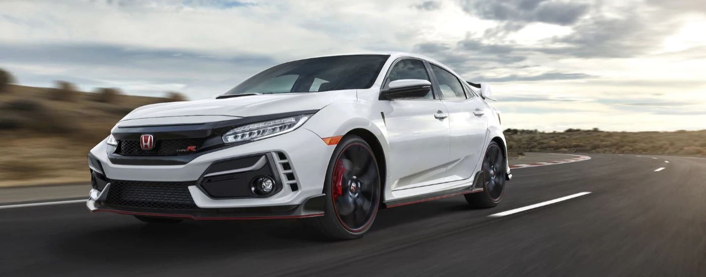 White 2021 Honda Civic Type R driving on a ractrack