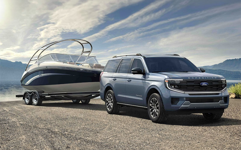 image of black ford suv with luggage on track