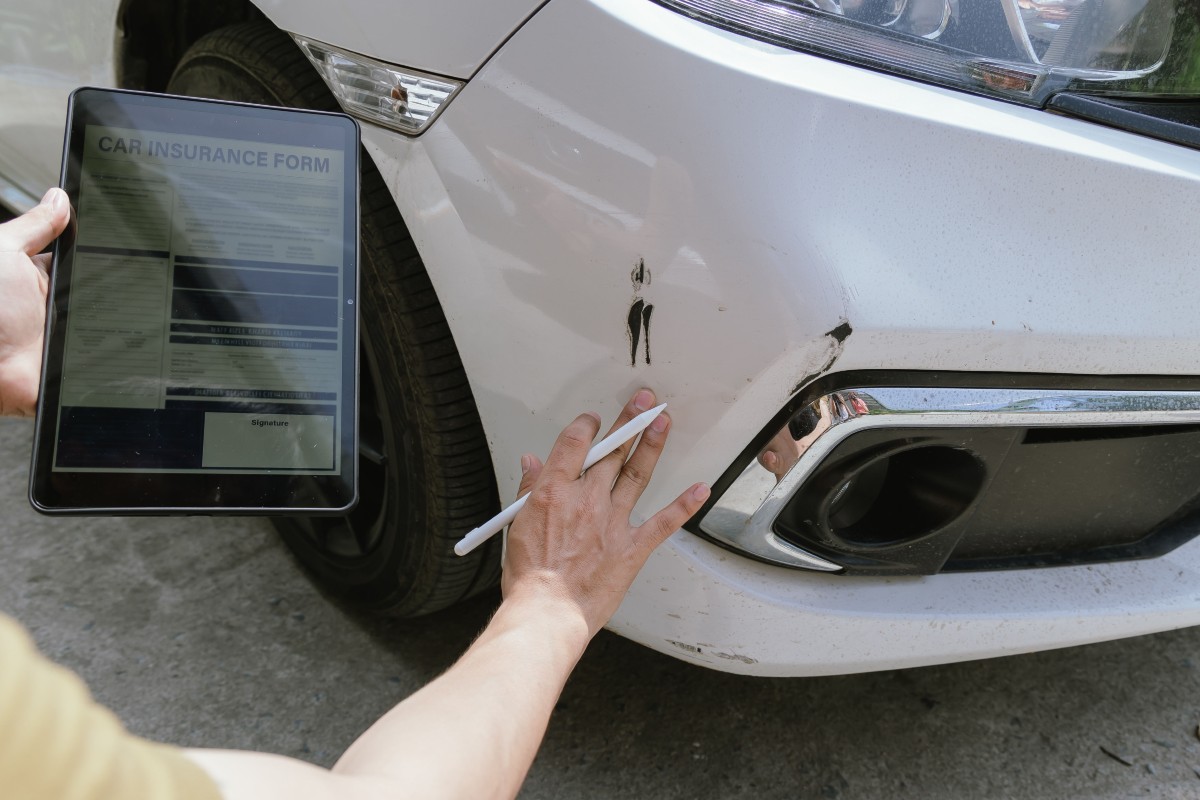 Insurance Agent Assessing Damage after Claim
