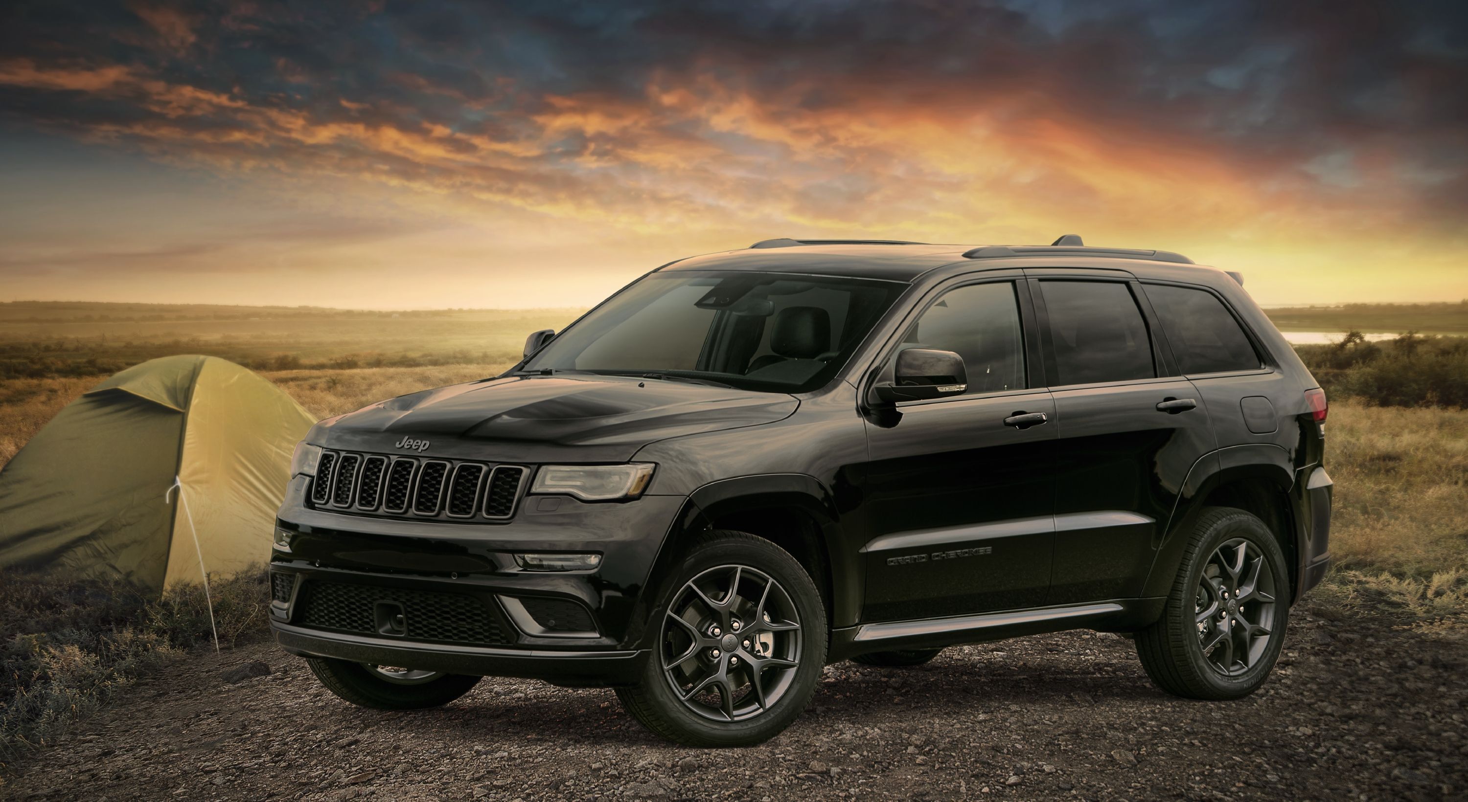 A black 2020 Jeep Cherokee parked.