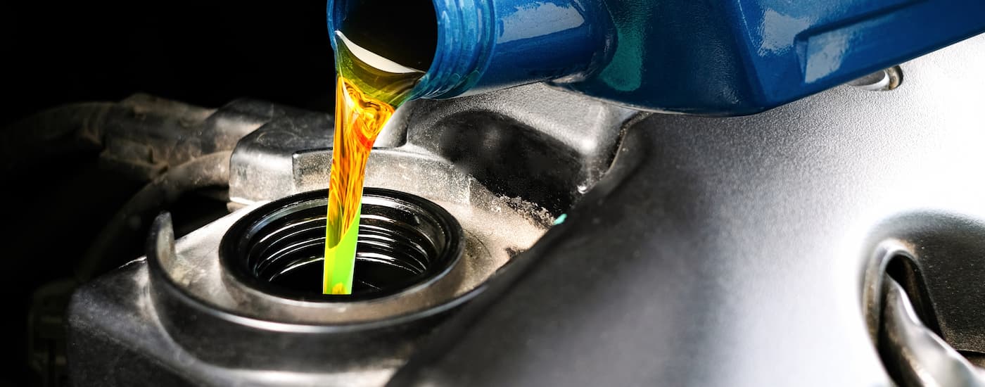 Oil being pouring into an engine during an oil change