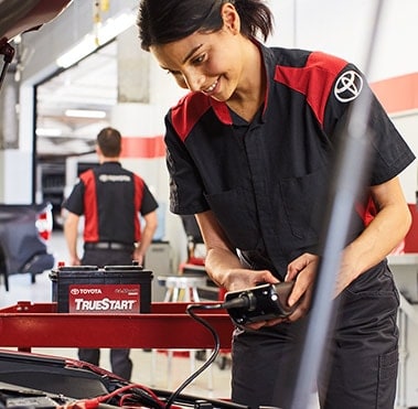 Toyota Technician working on battery
