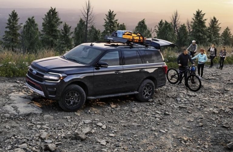 Black 2024 Ford Expedition Timberline with Family and Bikes on a Trail