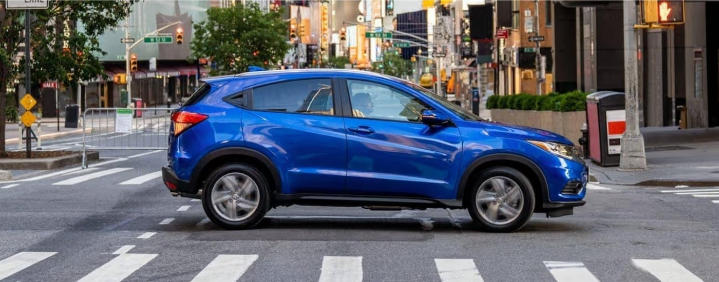Blue 2020 Honda HR-V EX-L driving on a city street