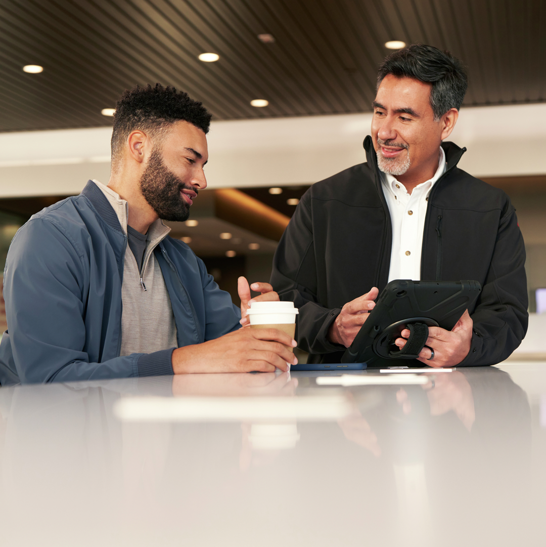 Customer speaks with Nissan dealership team member