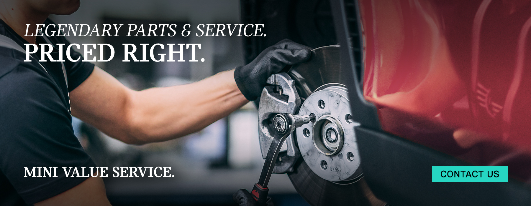 Service tech working on MINI brakes.