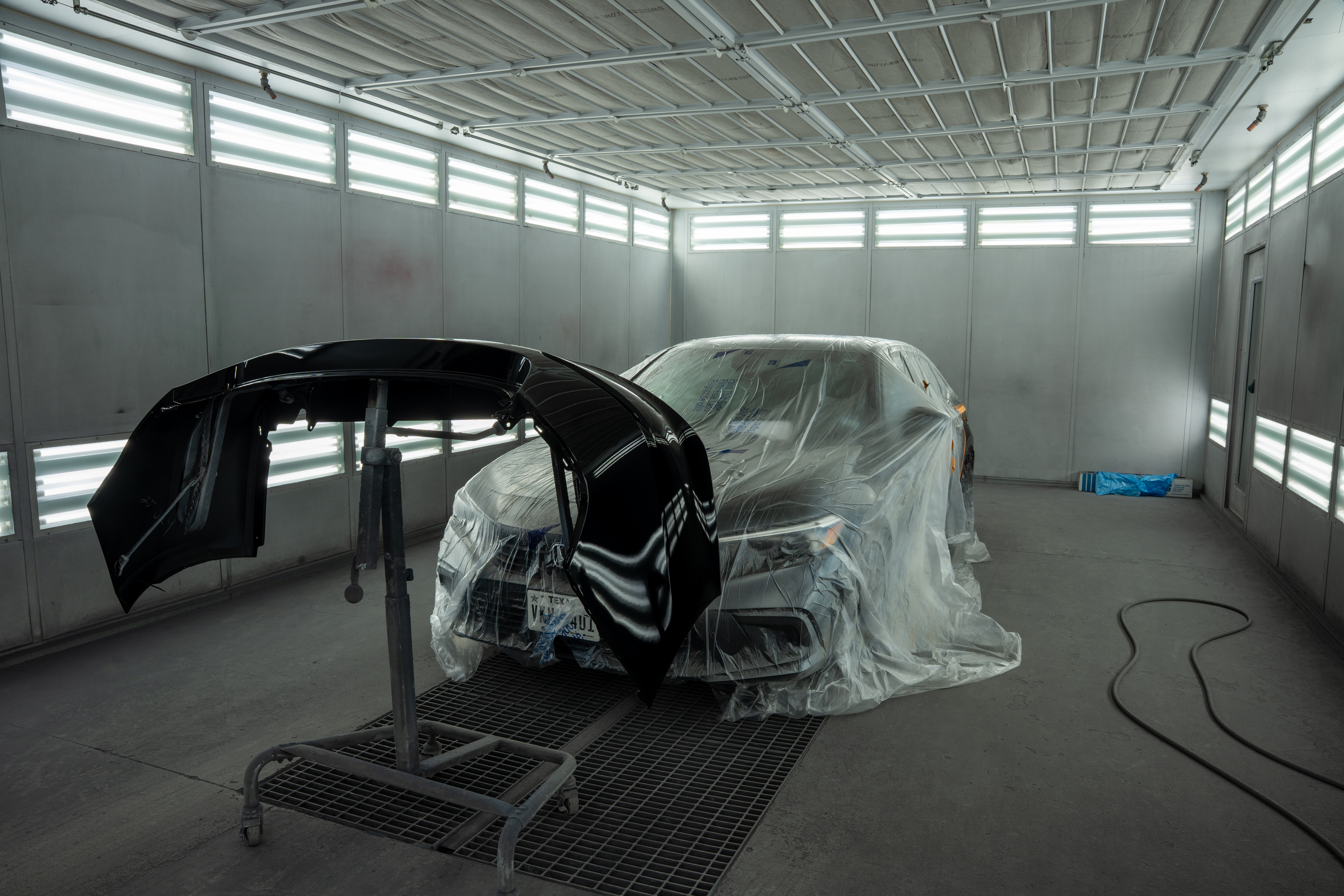 Performance Collision Center in Reading, PA. A Car is being parined in the booth 